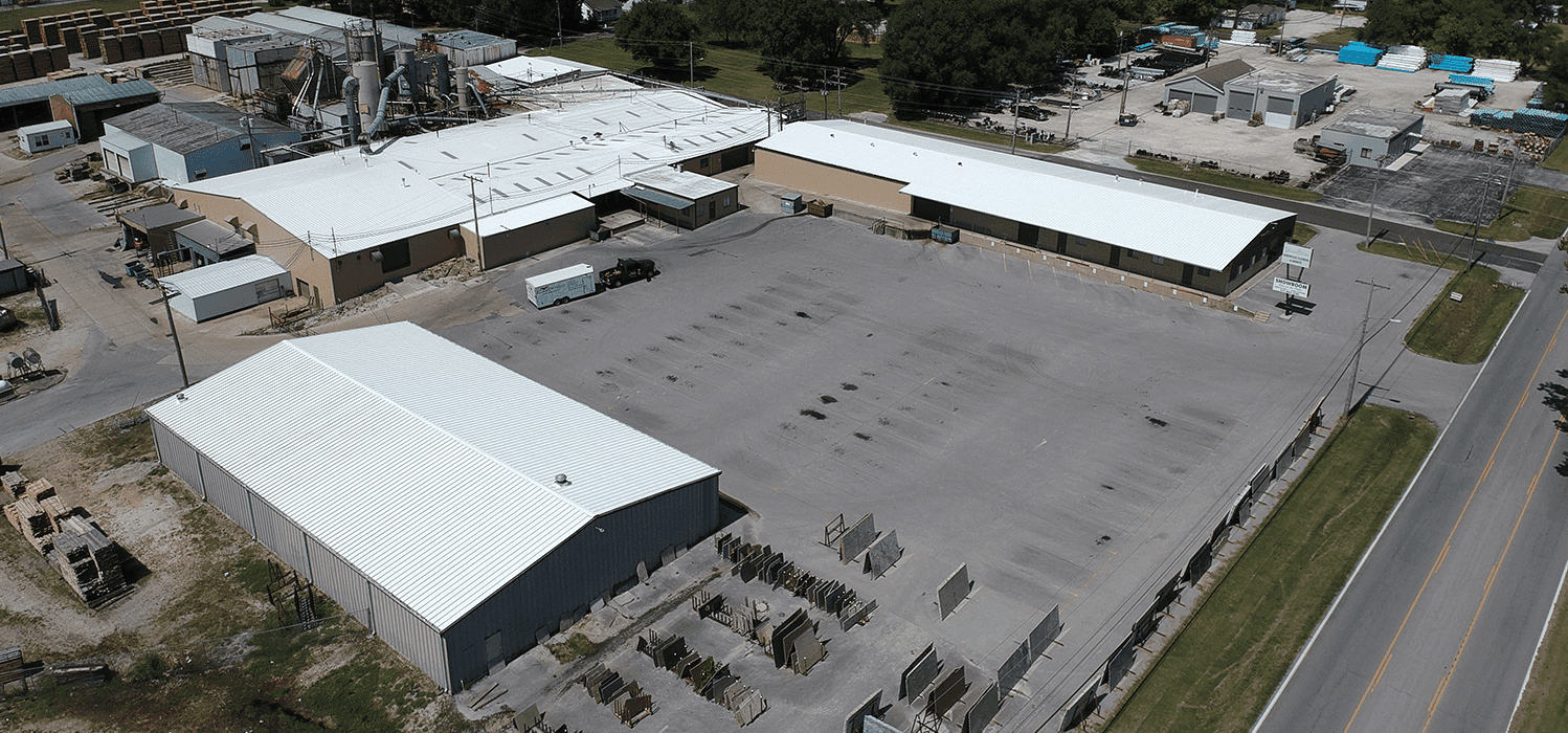 Stopping 50+ Leaks: Silicone Restoration at Vermillion Flooring, Springfield MO — completed roof coating project